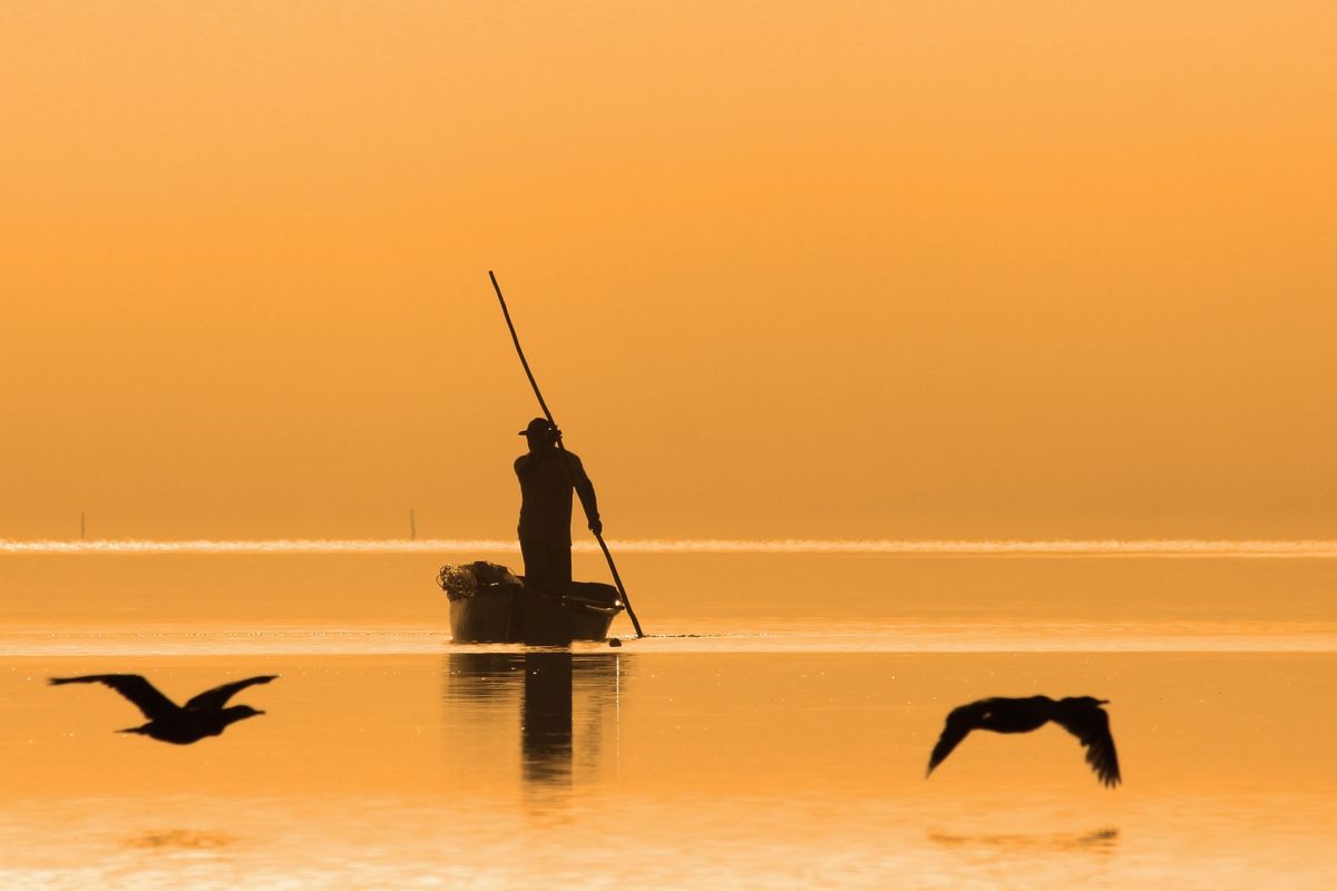 Fishermen at sunrise